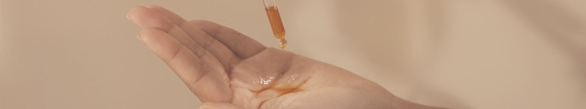 image of oil dropped on hand palm